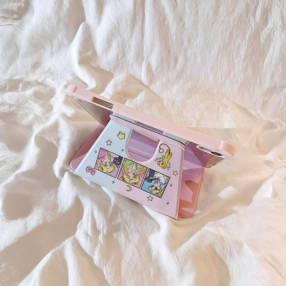 Pink anime girl iPad case in stand position, showing pastel sailor moon collage design